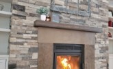 Oxford Ledgestone with custom brown fireplace surrounds