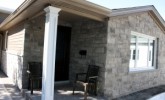 We went from full bed faux stone to a thin veneer transition on the porch and around the side of the house